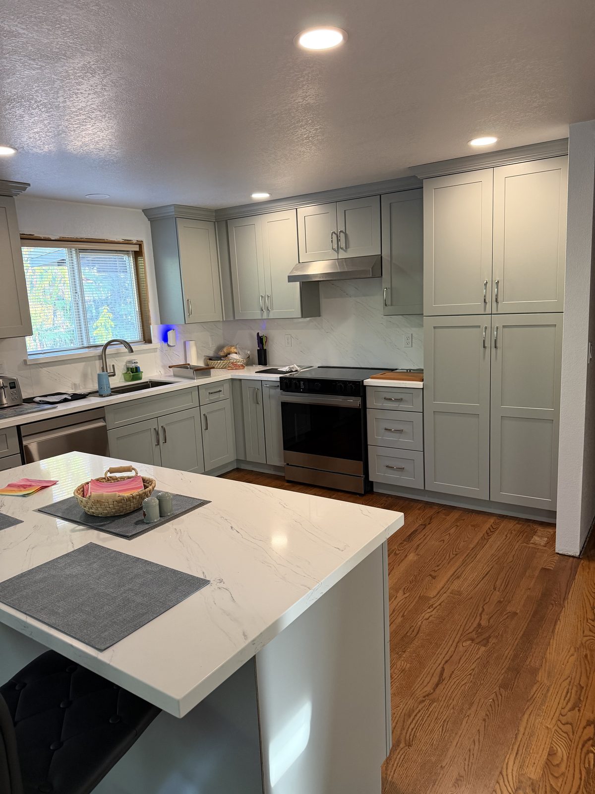 Hardwood filled in and refinished across the old wall line. Kitchen remodel in Lacey by DA Interior Solutions