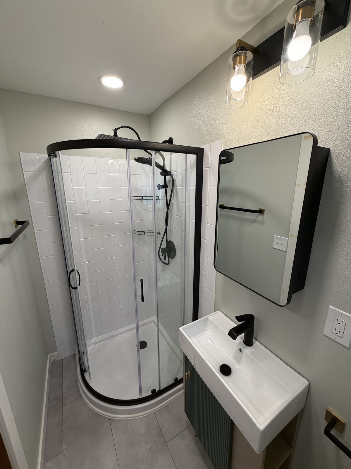 New vanity and sink, with the toilet moved clear of the door. Bathroom remodel in Puyallup by DA Interior Solutions