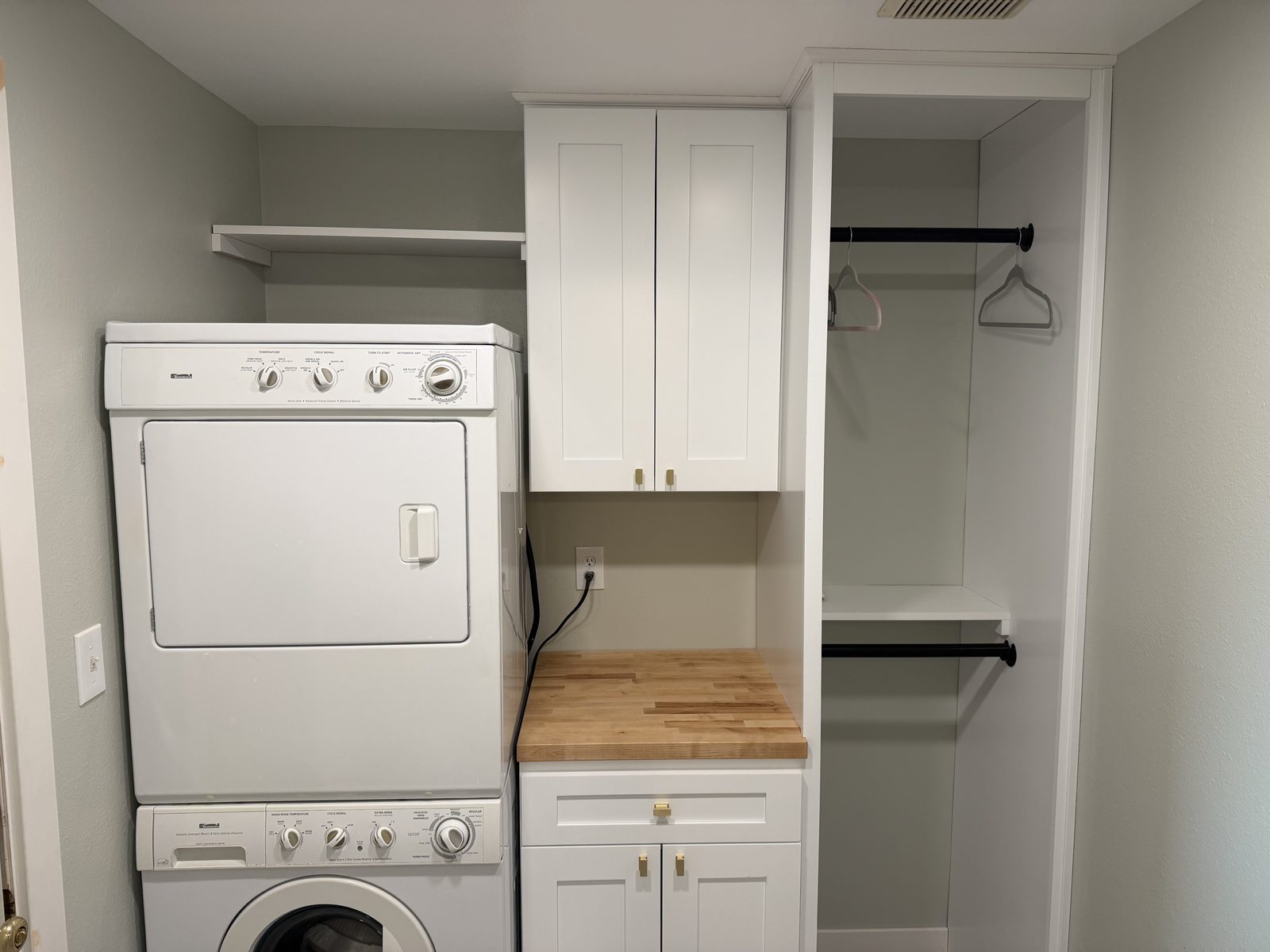 The laundry reconfigured, custom cabinet, butcher block top. Bathroom remodel in Puyallup by DA Interior Solutions